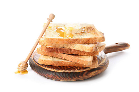 白色背景上加蜂蜜和黄油的美味烤面包图片