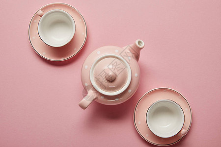 粉红面粉点茶壶和带有粉红背背景图片