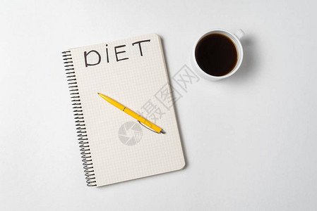 杯咖啡笔和记本标题饮食正上图片
