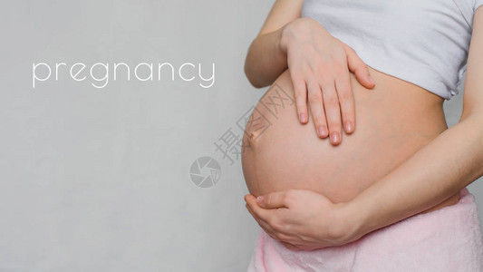 怀孕概念怀孕女童的欲其手图片