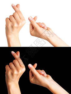 一组手握着两根手指或显示心脏标志的女子手图片