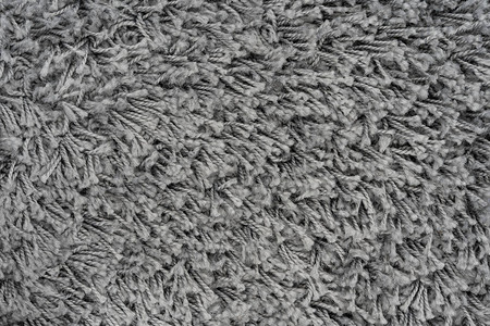 黑色天然毛绒地毯纹理背景深羊毛织布纹理背景图片
