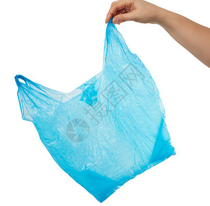 手握白色背景上的空蓝色塑料袋拒绝塑料的概念和向生图片