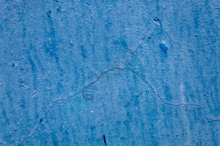 蓝漆开裂的混凝土墙体纹理图片
