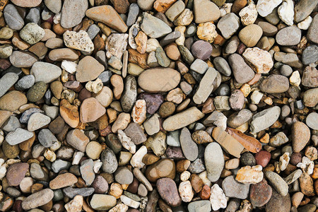 海滩石头棕色小卵石纹理和背景图片