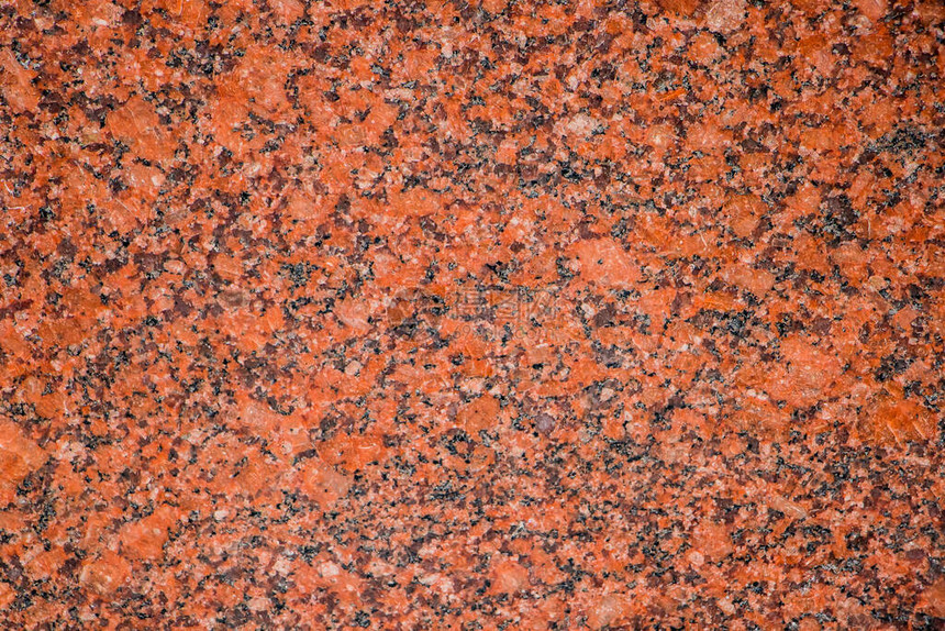 从橙色花岗岩板关闭的背景图片