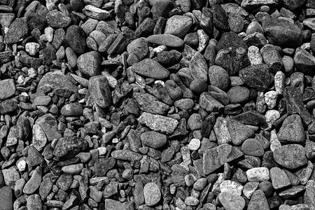 黑色小路石背景深色砾石鹅卵石纹理花背景图片