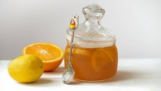 橙和柠檬果冻或果酱在玻璃罐子里图片