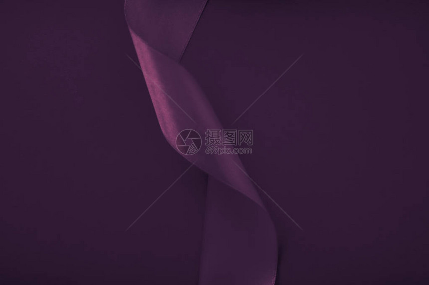 品牌假日和奢华品牌概念紫色背景上的抽象卷曲丝带假日销售产品促销的独家奢侈品牌设计和魅力艺图片