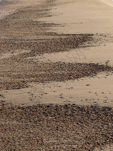 与沙子纹理海水和沙子地层在海滩的抽象纹理图片
