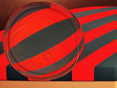 具有明亮红色和黑色对角线条状的玻璃球体图片