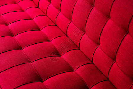 红罩软棉布缝制沙发的精细纹理家具背图片