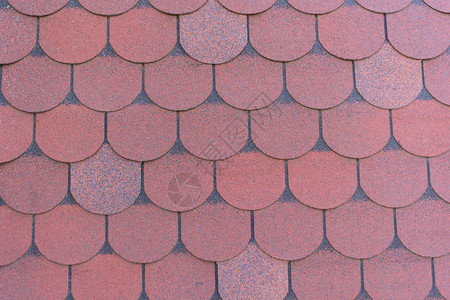 详细的纹理红色沥青瓦屋顶材料背景图片