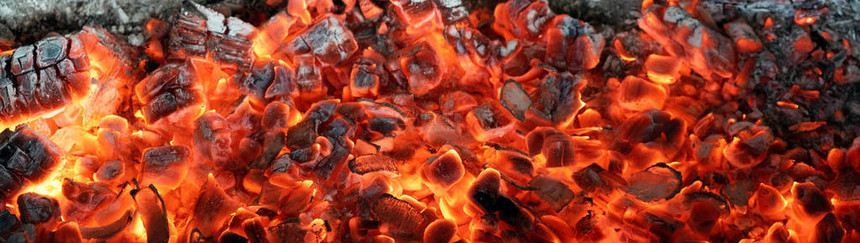 在壁炉抽象背景中燃烧煤炭图片