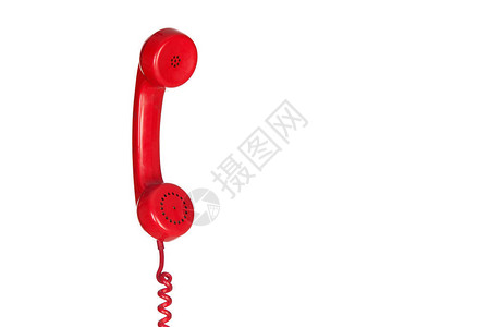 红色古老电话挂在白色背景的一图片
