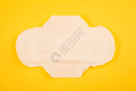 黄色背景的卫生棉垫和卫生棉背景图片