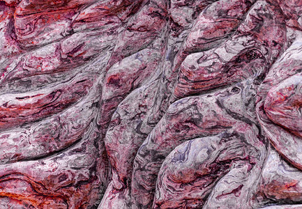 纹理背景的曲线红色岩石层表面大理石图片