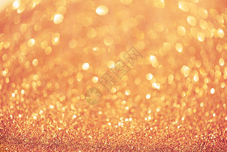 粉色和金色抽象的bokeh灯光有复制空间的亮光背景新年和圣诞节概图片