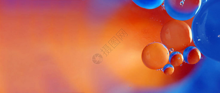 抽象空间背景水中油滴橙色和蓝色背景图片