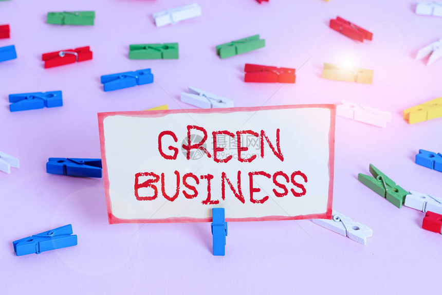 手写文本绿色业务不会对环境产生负面影响的概念照片公司彩色衣夹纸空提醒粉红色地板背图片