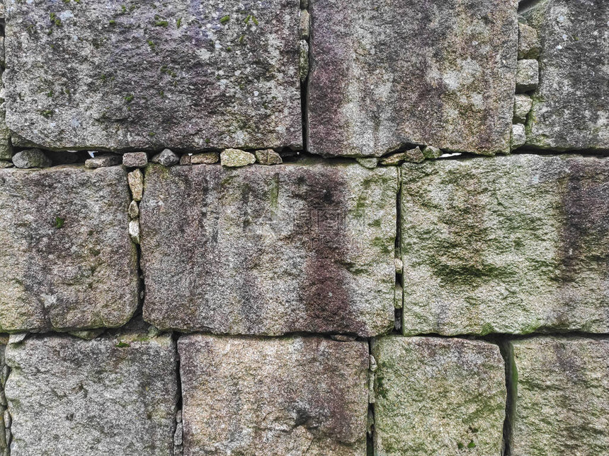 具有规则形状的矩形石块的石墙纹理图片