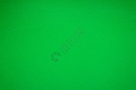 从皮革纹理的绿色背景图片