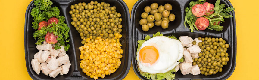用黄色隔开的蔬菜肉类煎蛋和沙拉的生态图片