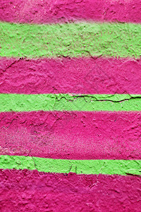 旧墙漆成多汁的粉红色和绿色背景图片
