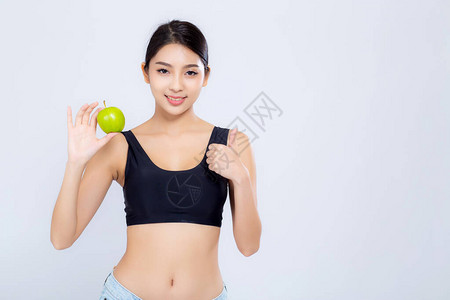肖像亚洲女人微笑着拿绿色苹果水和美丽的身体饮食与适合孤立的白色背景图片