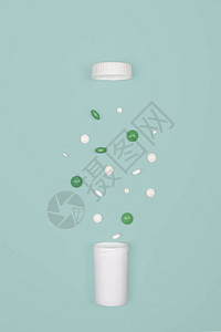 有药丸的医学背景白绿药丸从瓶子里倒在蓝色的背景上图片