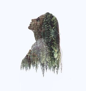 女双曝光剪影头像与绿树背景相结合显示人与自然统一的概念图像生态自由和平图片