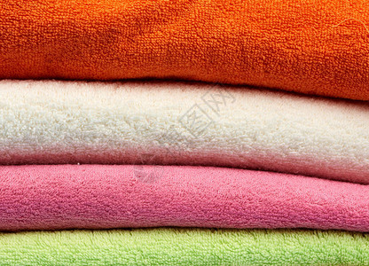 一堆彩色棉毛巾折叠毛巾特写图片