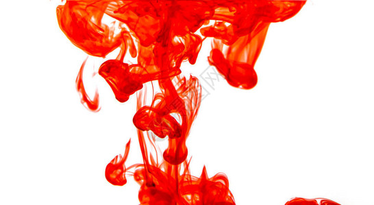 红色油漆飞溅滴入清澈的水中图片