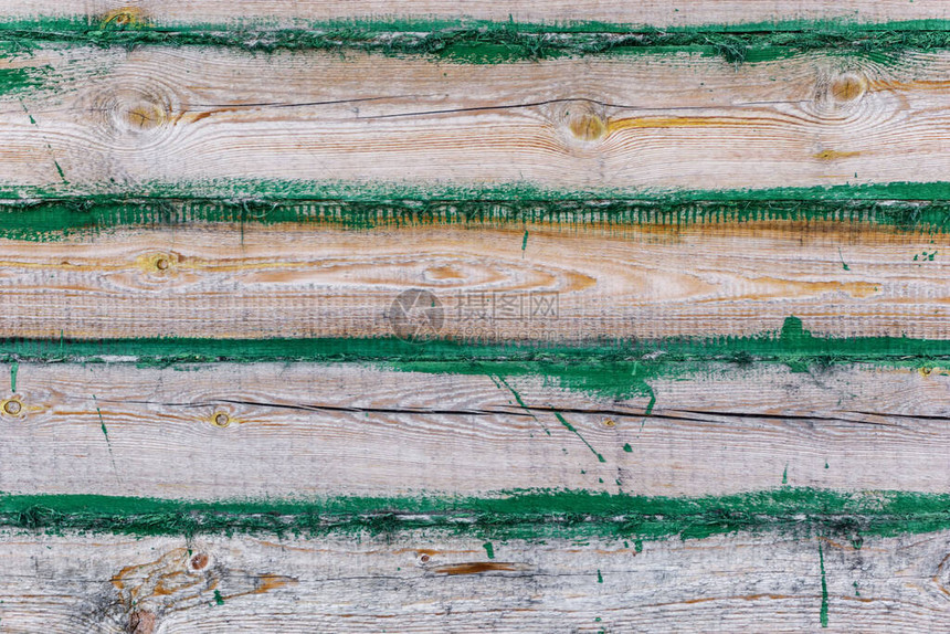 用绿色油漆背景的木板和面板制成的木屋建筑房屋的木墙图片