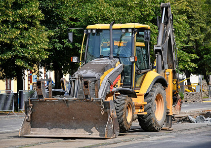 在道路建设的挖掘机背景图片