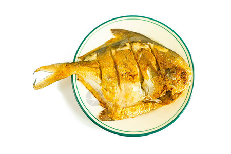 用食油煎锅烤一条咸的松瓜鱼然图片