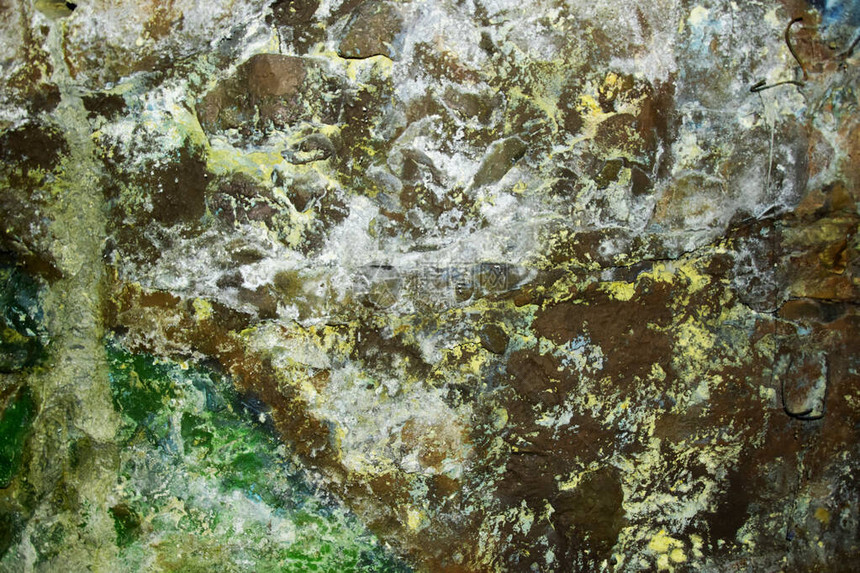由石头混凝土制成的灰黄绿色自然背景绿色混沌浸渍石质地抽象背景图像有黄色和灰色和绿色斑图片