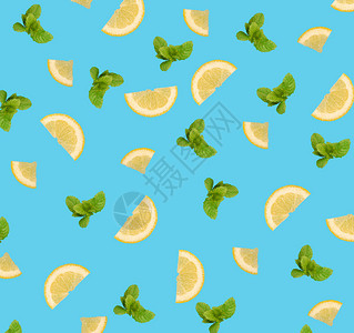 蓝色背景上的柠檬片和薄荷叶图案图片
