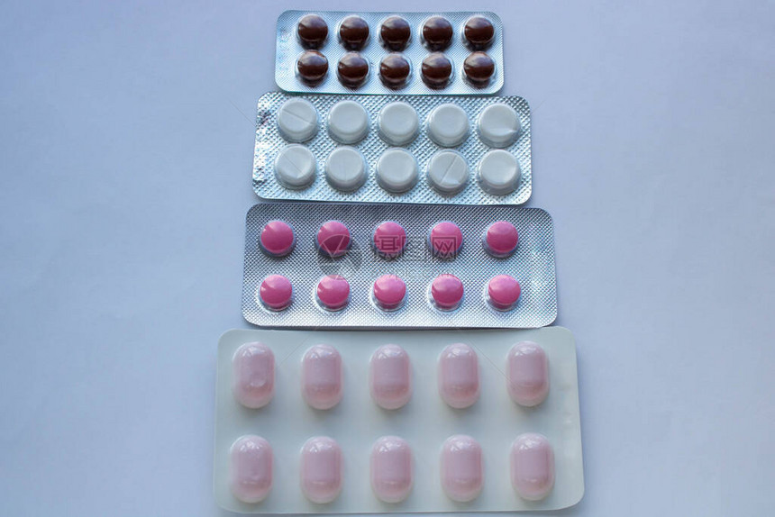 冠状的概念药品抗生素药丸彩色抗菌药丸白色背景胶囊药图片