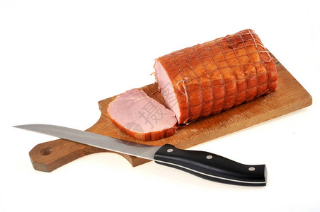 烤熏猪肉在切菜板上刀子图片