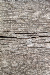 旧风化开裂的灰色木材纹理背景图片