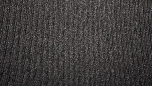 纹理黑色紧密编织地毯地毯的深色背景背景图片