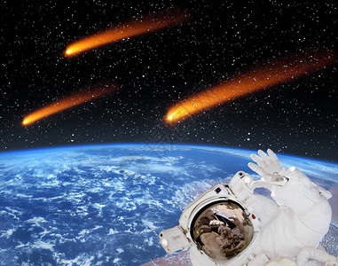 上面的地球和彗星宇航员正前方摆放着由美国航天局提图片