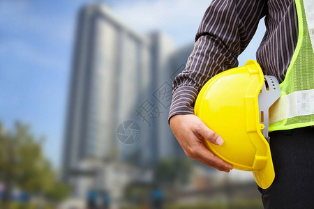 大型公寓建筑工地亚洲商人建筑工程师或带黄色防护图片