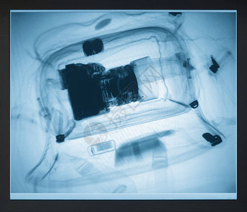 X射线监视器上袋子里的照片相机图片