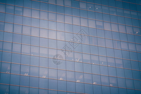 蓝色玻璃表面摩天大楼的墙壁现代建图片