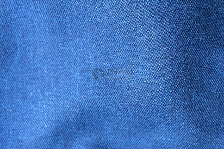 选择聚焦蓝色牛仔裤牛仔布顶视图近距离拍摄织物的细节纺织材料和棉花图案坚韧耐用的服装款式用于带有文本复制空间图片