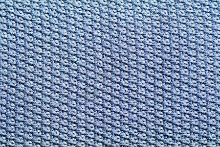 蓝色针织面料纹理背景打结的地毯特写图片