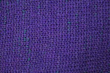 以紫色羊毛针织面料为背景的质地图片