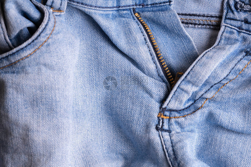 蓝棉布牛仔裤有创意的古老背景口袋和拉链图片
